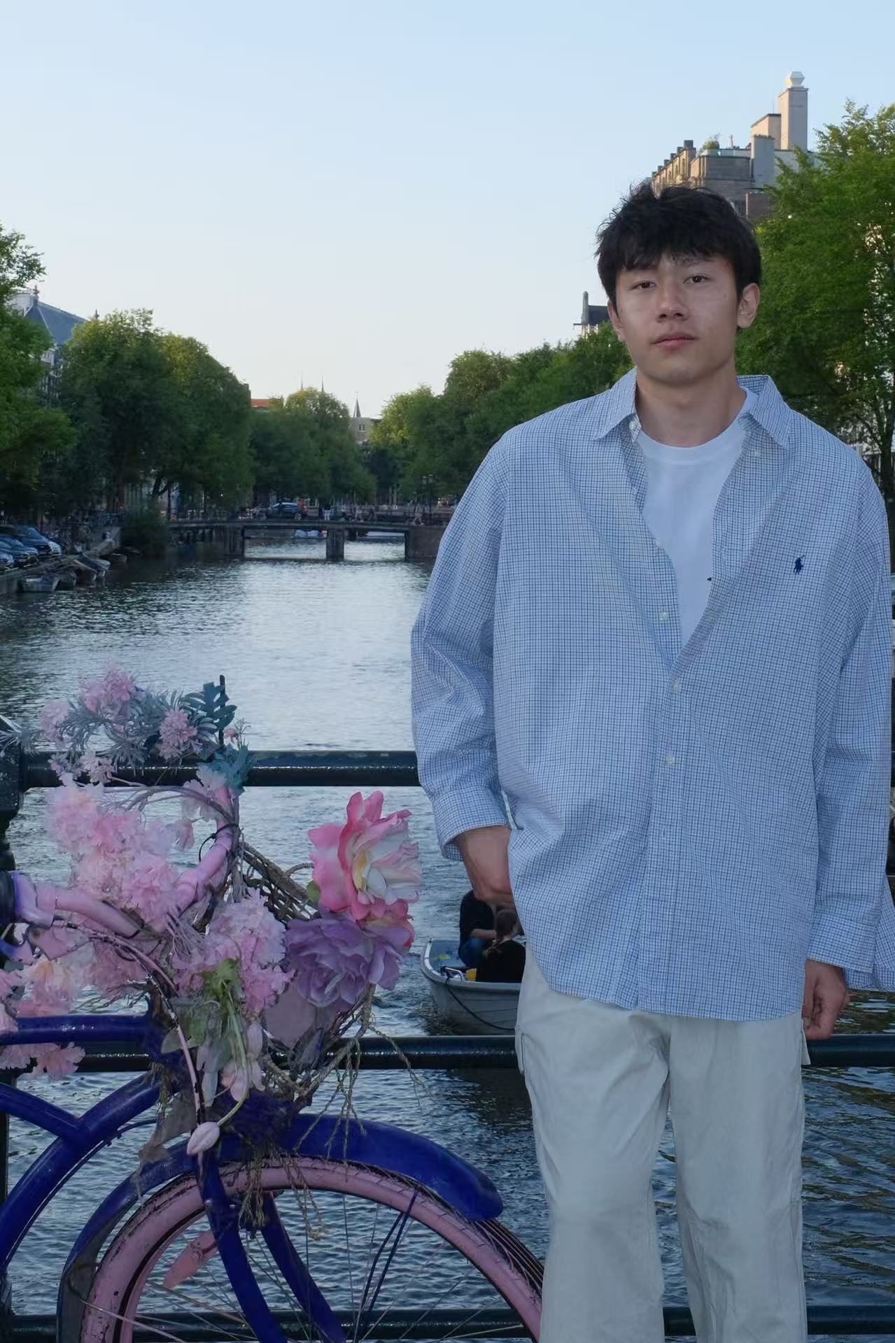 Weichen Xue standing beside a canal